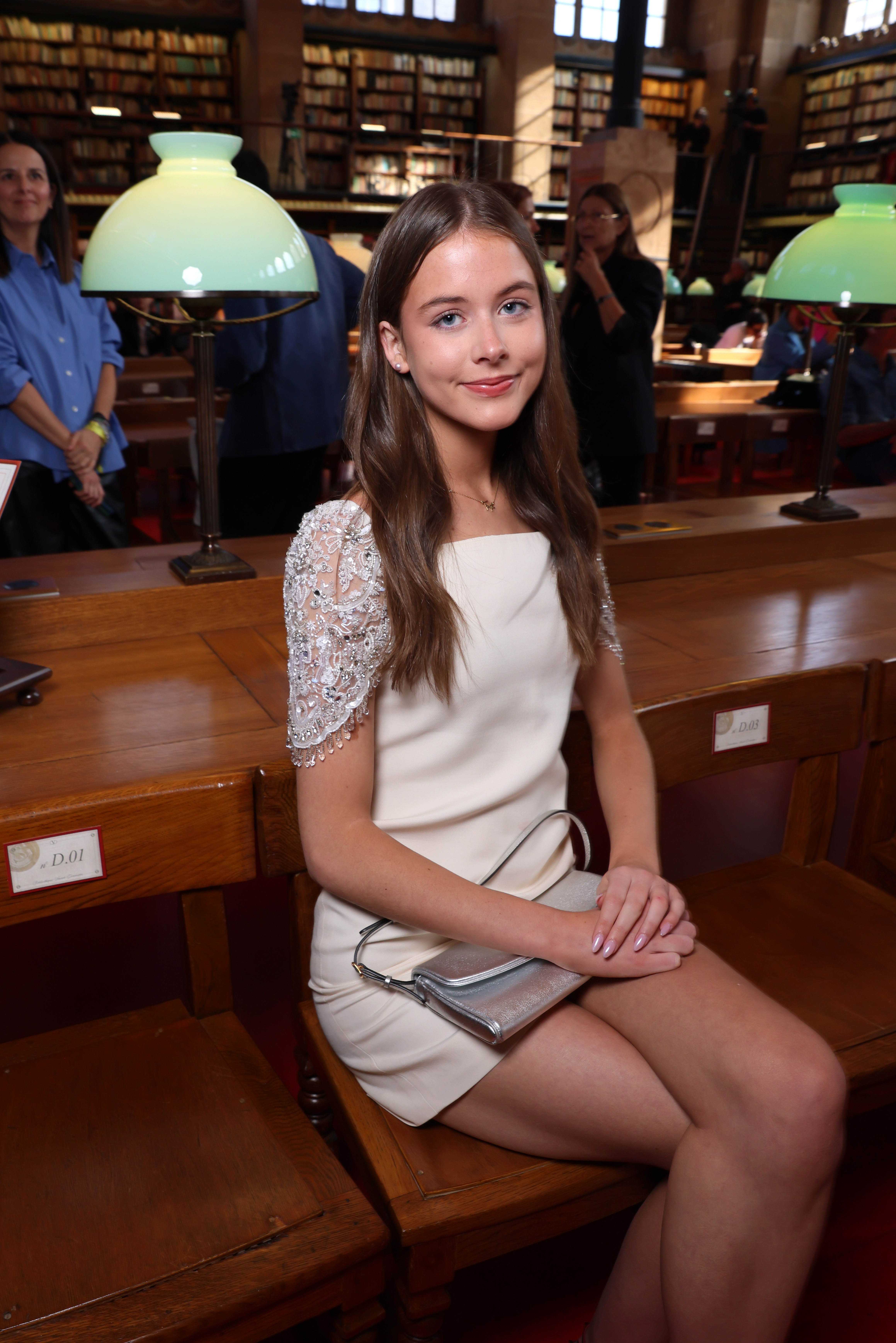 Faith Margaret, 15, poses at Valentino’s Paris Fashion Week show without her mother, Nicole Kidman. The teenager wore a white mini dress with embellished sleeves and black strappy heels, showing off her own sense of style. | Source: Getty Images