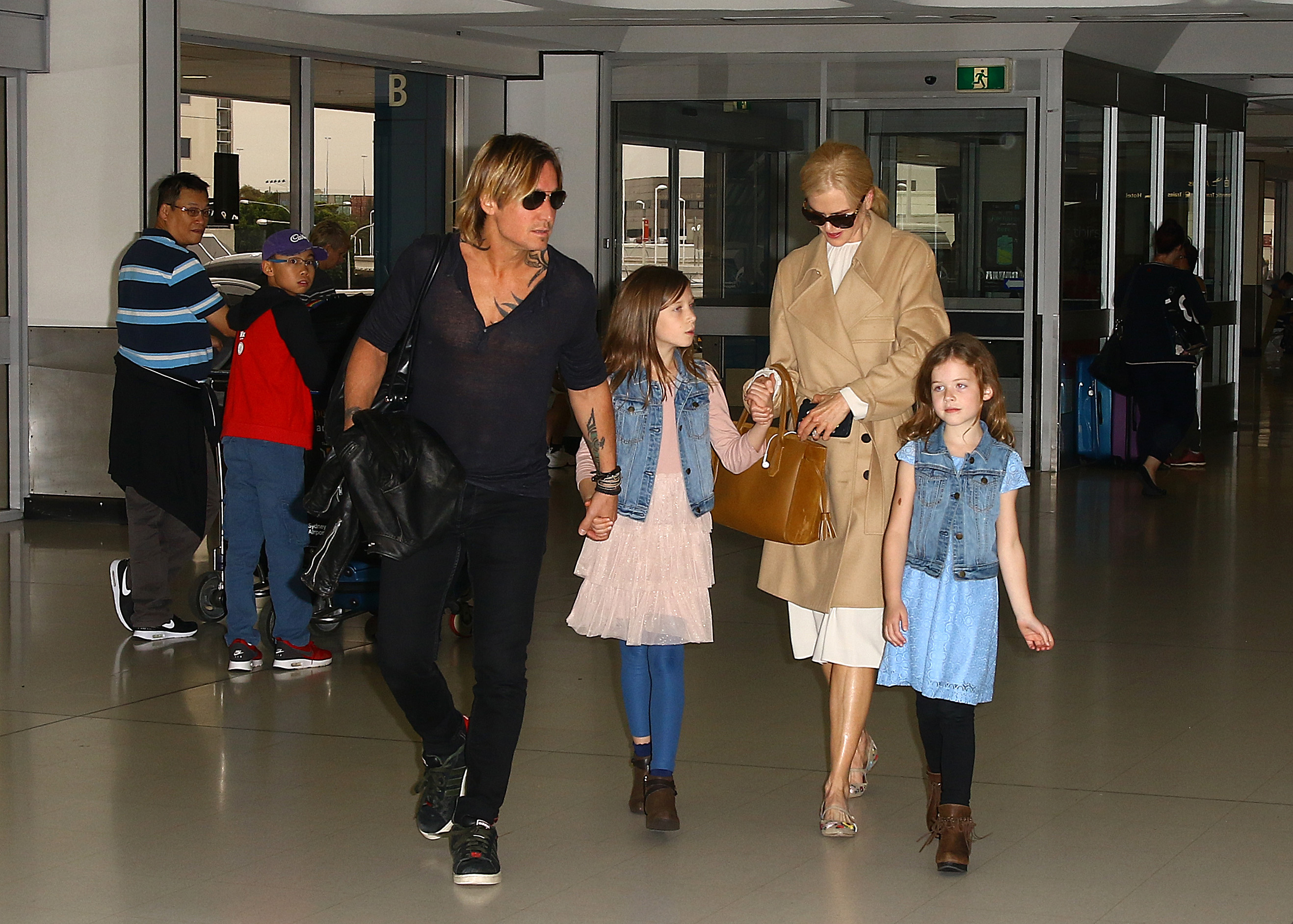 Nicole Kidman and Keith Urban arrive at Sydney Airport with daughters Sunday Rose, eight, and Faith Margaret, six, in March 2017. Both girls were born in Nashville, Tennessee, where the family maintained its home base. | Source: Getty Images