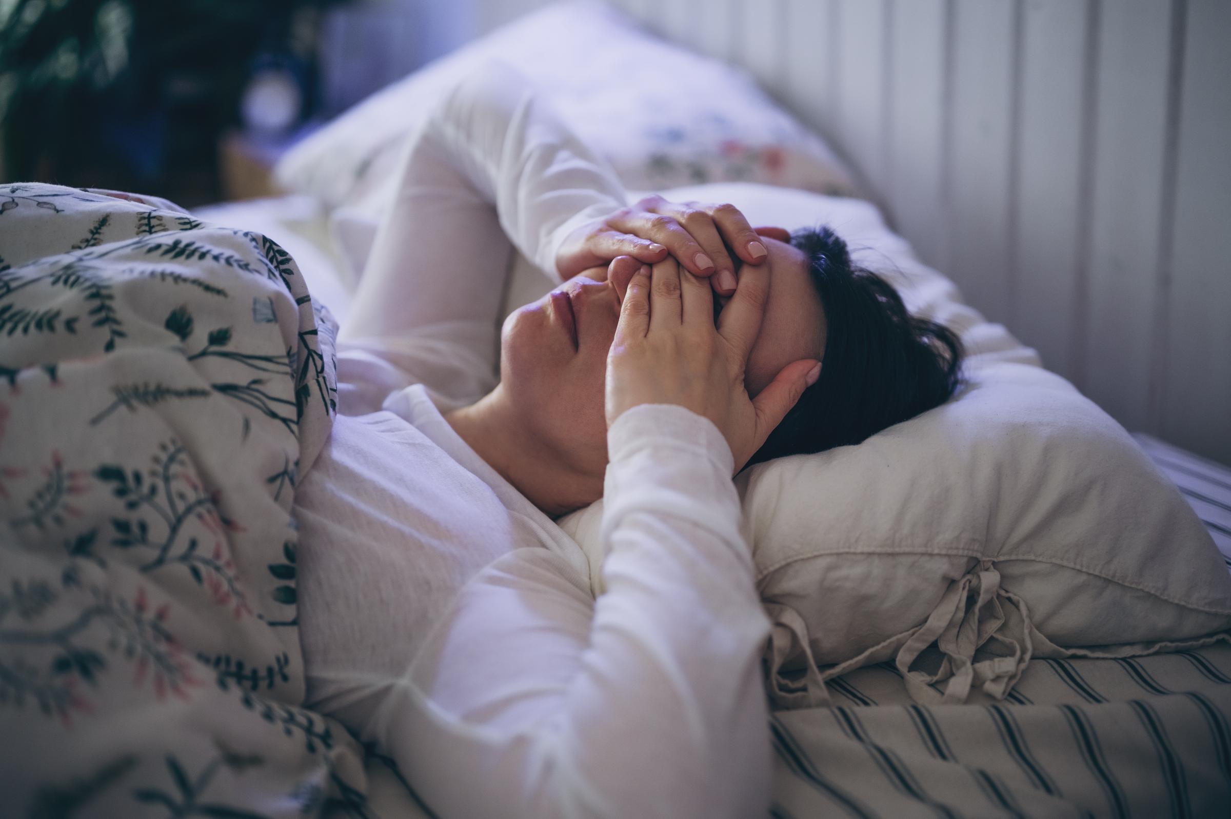A woman suffering from insomnia, awake at night | Source: Getty Images