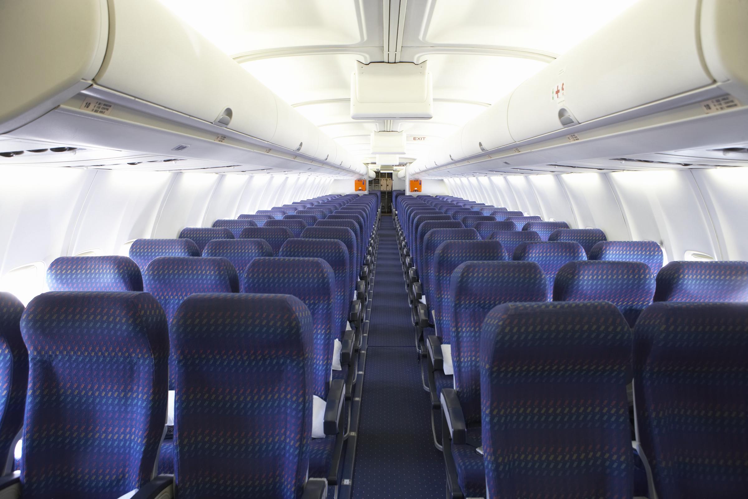 Rows of empty seats on an airplane | Source: Getty Images