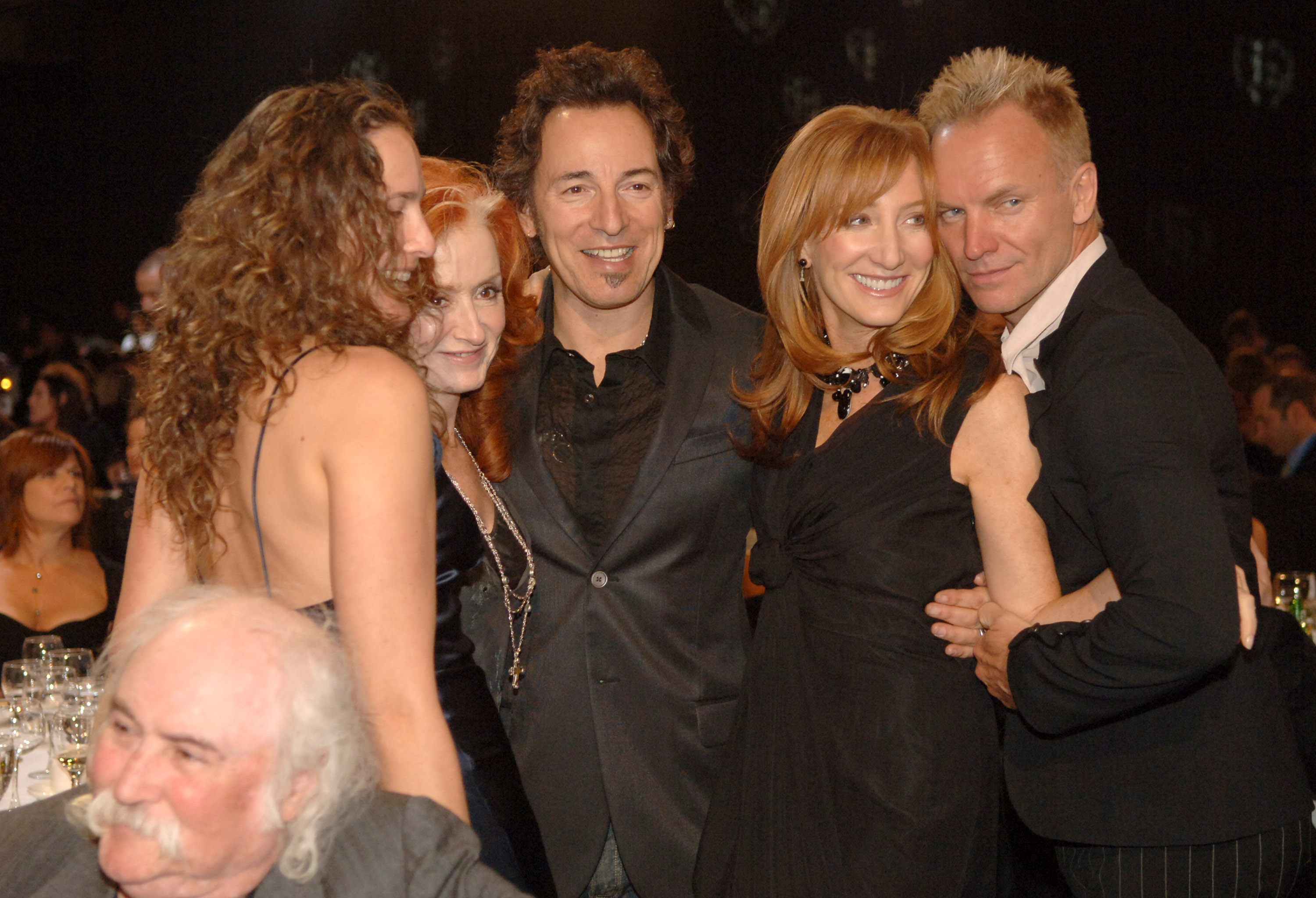 At the 2006 MusiCares Person of the Year event honoring James Taylor, Trudie Styler, Bruce Springsteen, Sting, and Patti Scialfa are captured backstage sharing smiles. | Source: Getty Images