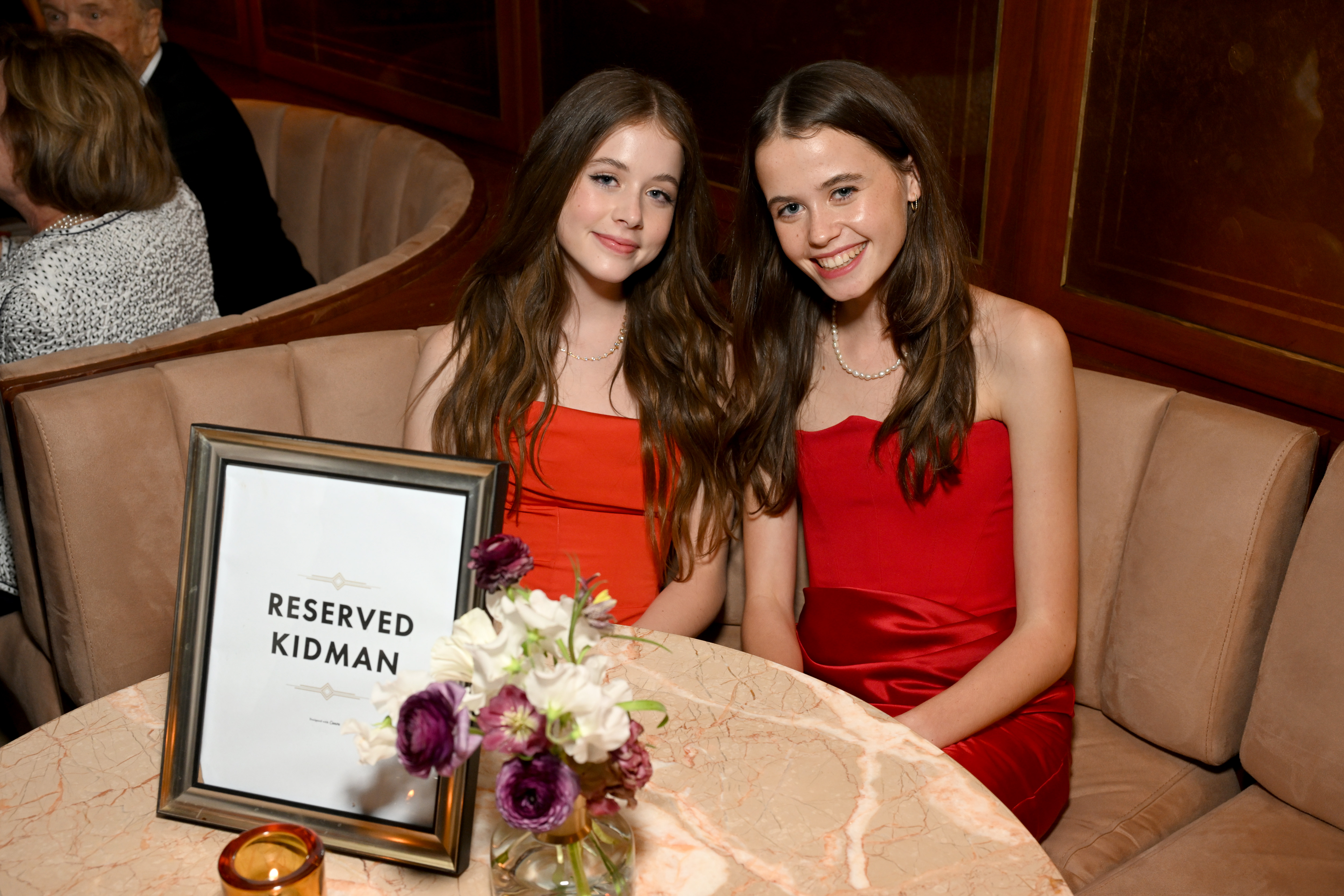 Faith Margaret Kidman Urban and her cousin Sybella Hawley, daughter of Nicole Kidman's sister Antonia, wear matching red dresses at the AFI Life Achievement Award after-party in April 2024. | Source: Getty Images