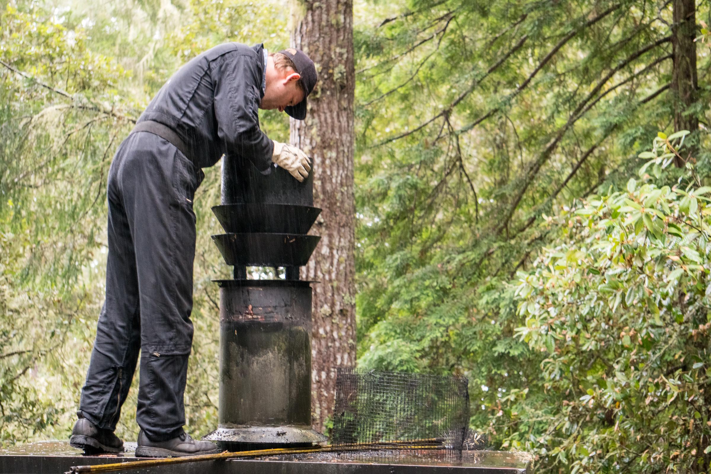A man examining the inside of a chimney | Source: Getty Images