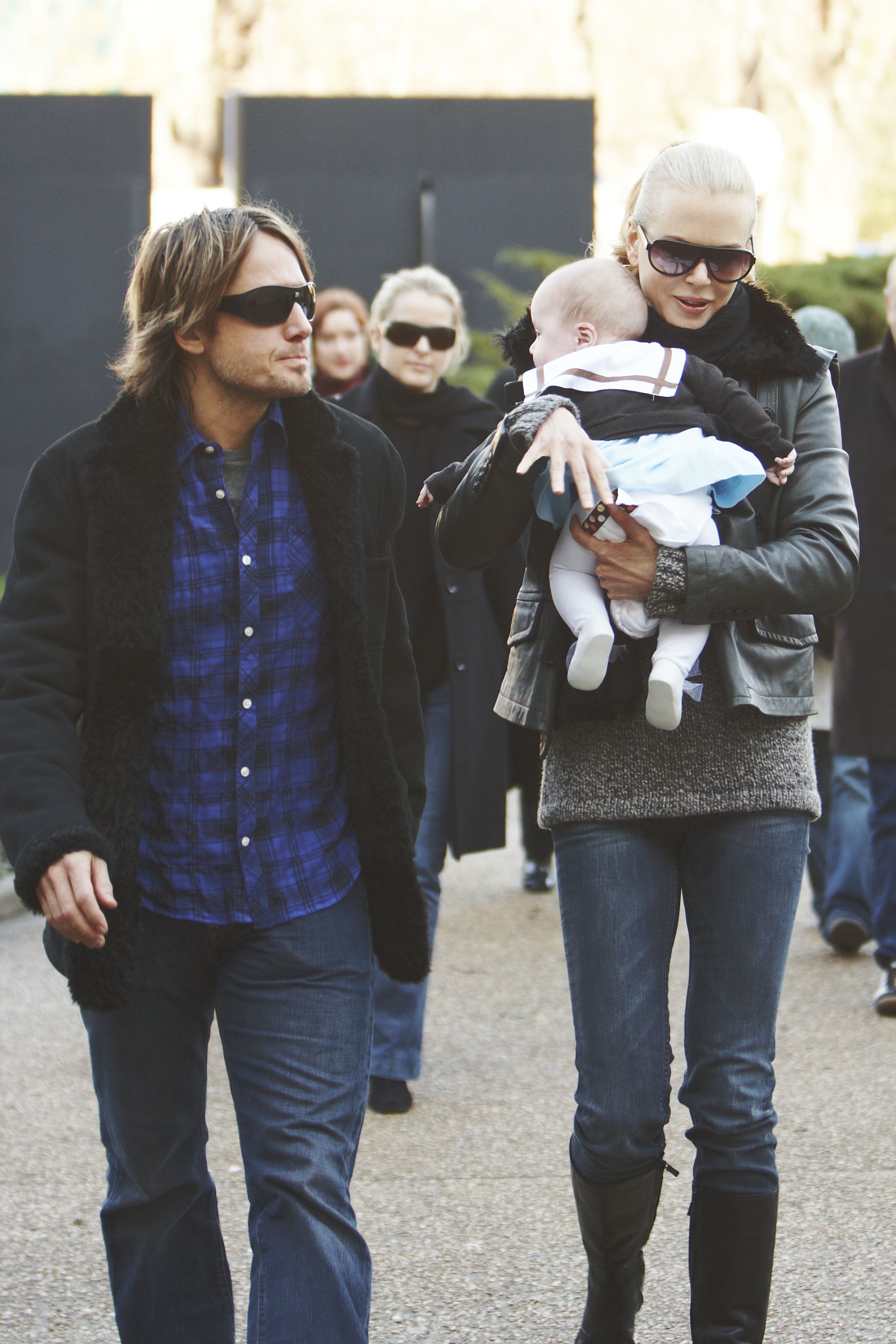 Nicole Kidman carries her baby daughter Sunday Rose during a family visit to the Grand Palais in Paris on December 2, 2008, with Keith Urban beside her. Faith Margaret would join the family two years later. | Source: Getty Images