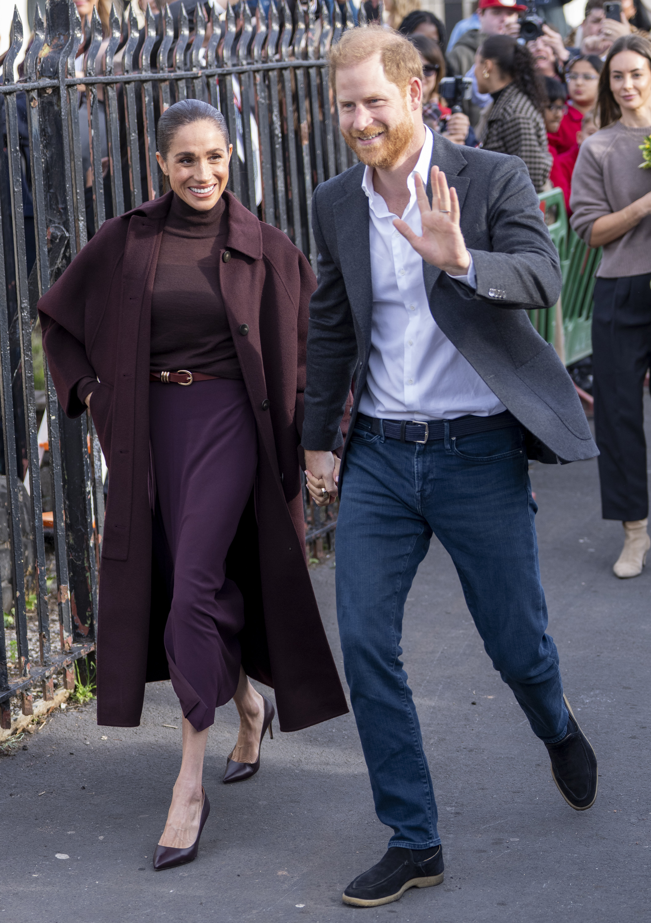 Harry and Meghan greet well-wishers at the Community Recording Studio (CRS). | Source: Getty Images