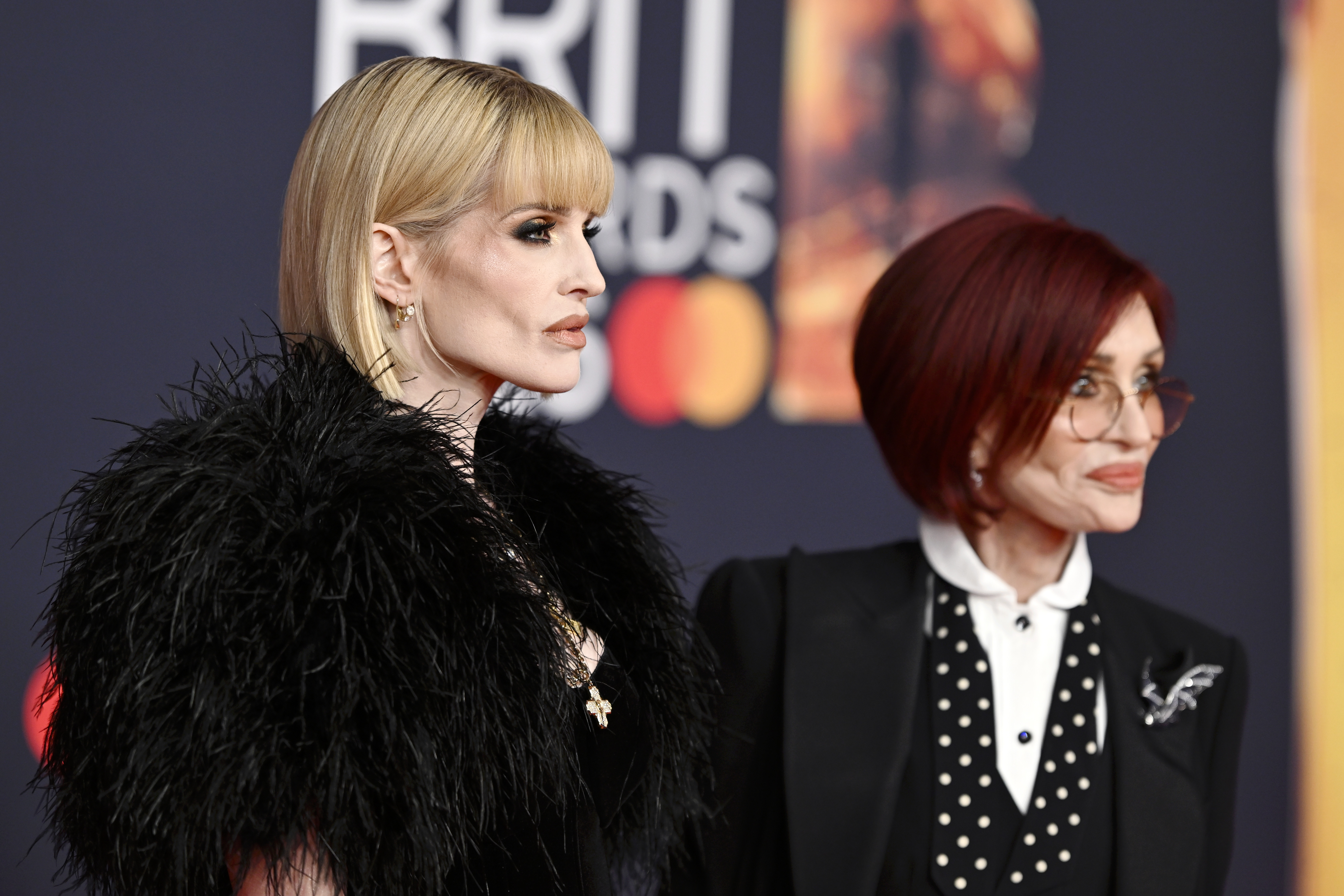 Kelly and Sharon Osbourne stood side by side at the 2026 BRIT Awards, where they came together to honor Ozzy Osbourne and accept his posthumous Lifetime Achievement Award. | Source: Getty Images.