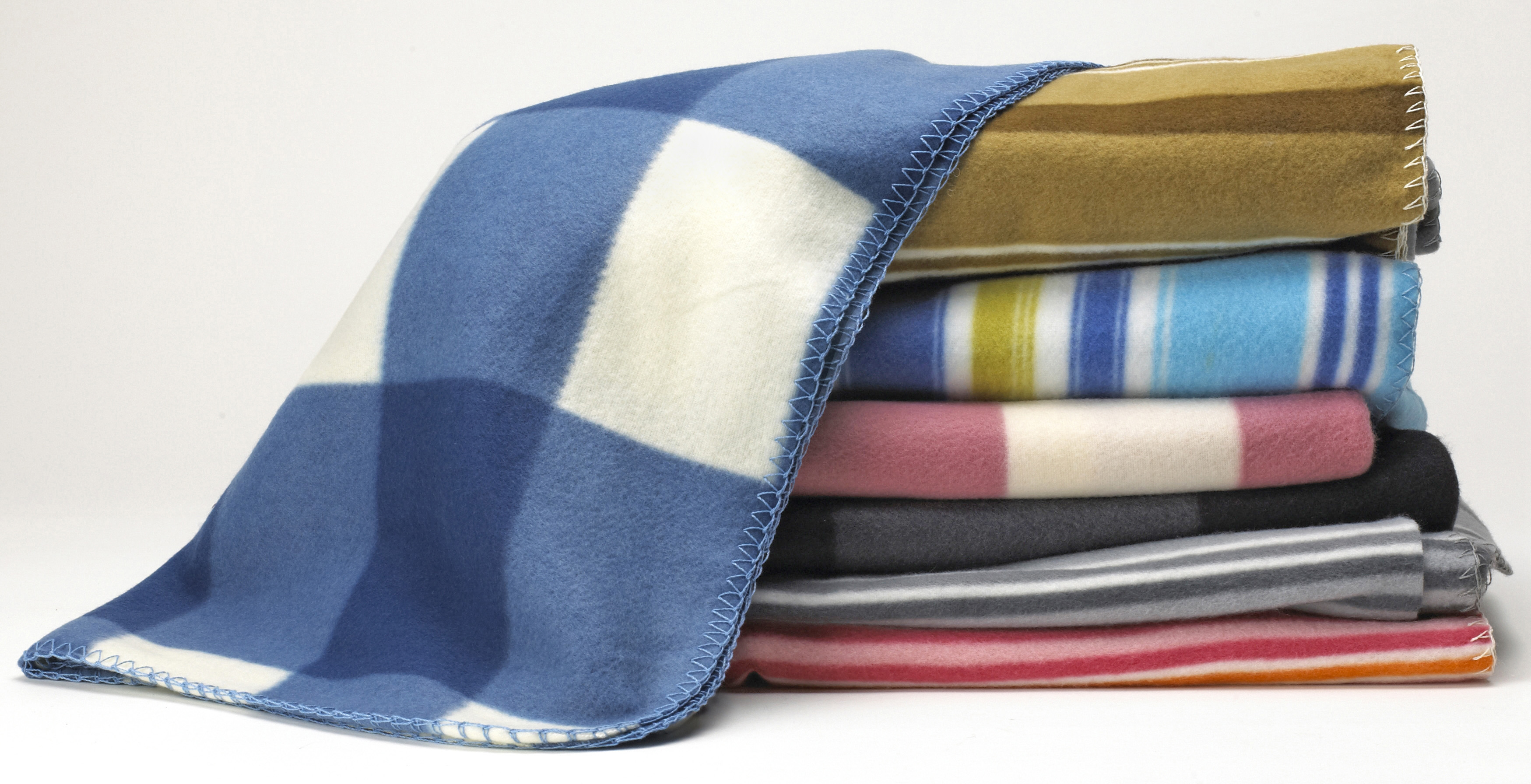 Stacked fleece blankets | Source: Getty Images