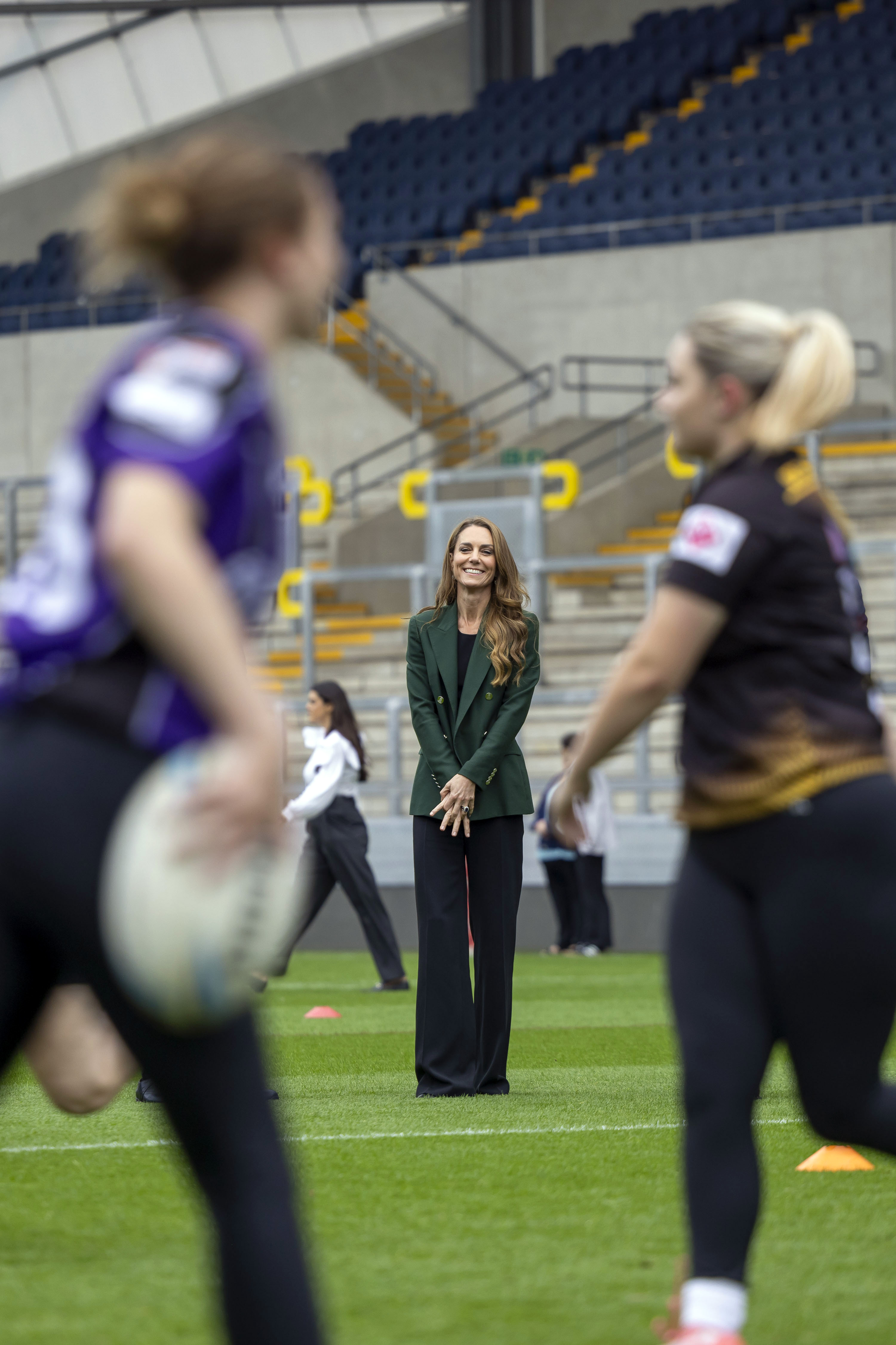 Catherine looked on as players took part in a training session at Headingley Stadium. Her appearance in a tailored green pantsuit stood in contrast to the action unfolding on the field. | Source: Getty Images