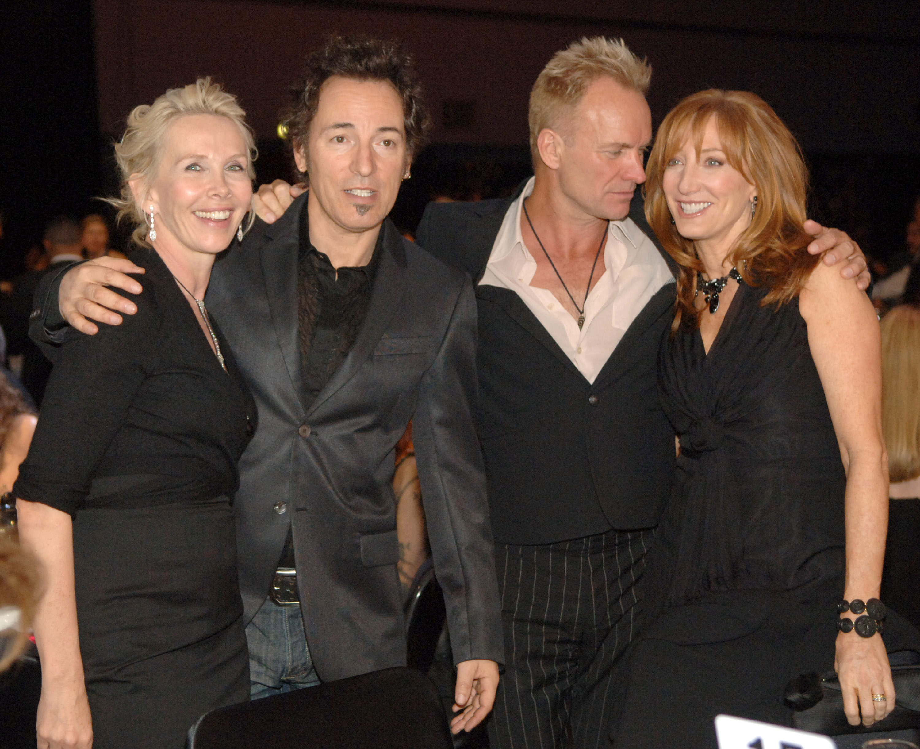 Backstage at the 2006 MusiCares Person of the Year event honoring James Taylor, Trudie Styler joins Bruce Springsteen, Sting, and Patti Scialfa for a group photo. | Source: Getty Images