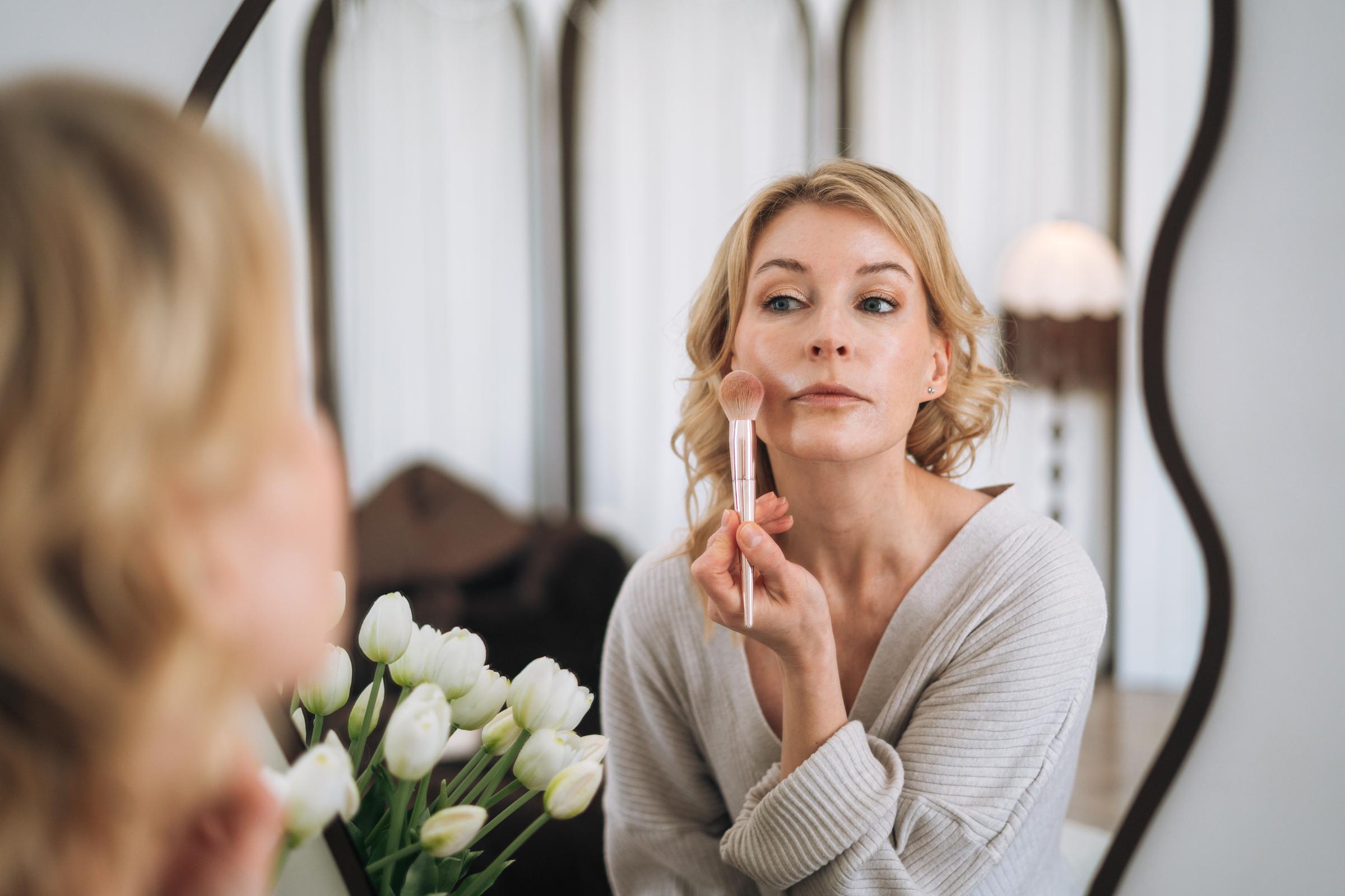 A woman applying makeup | Source: Getty Images