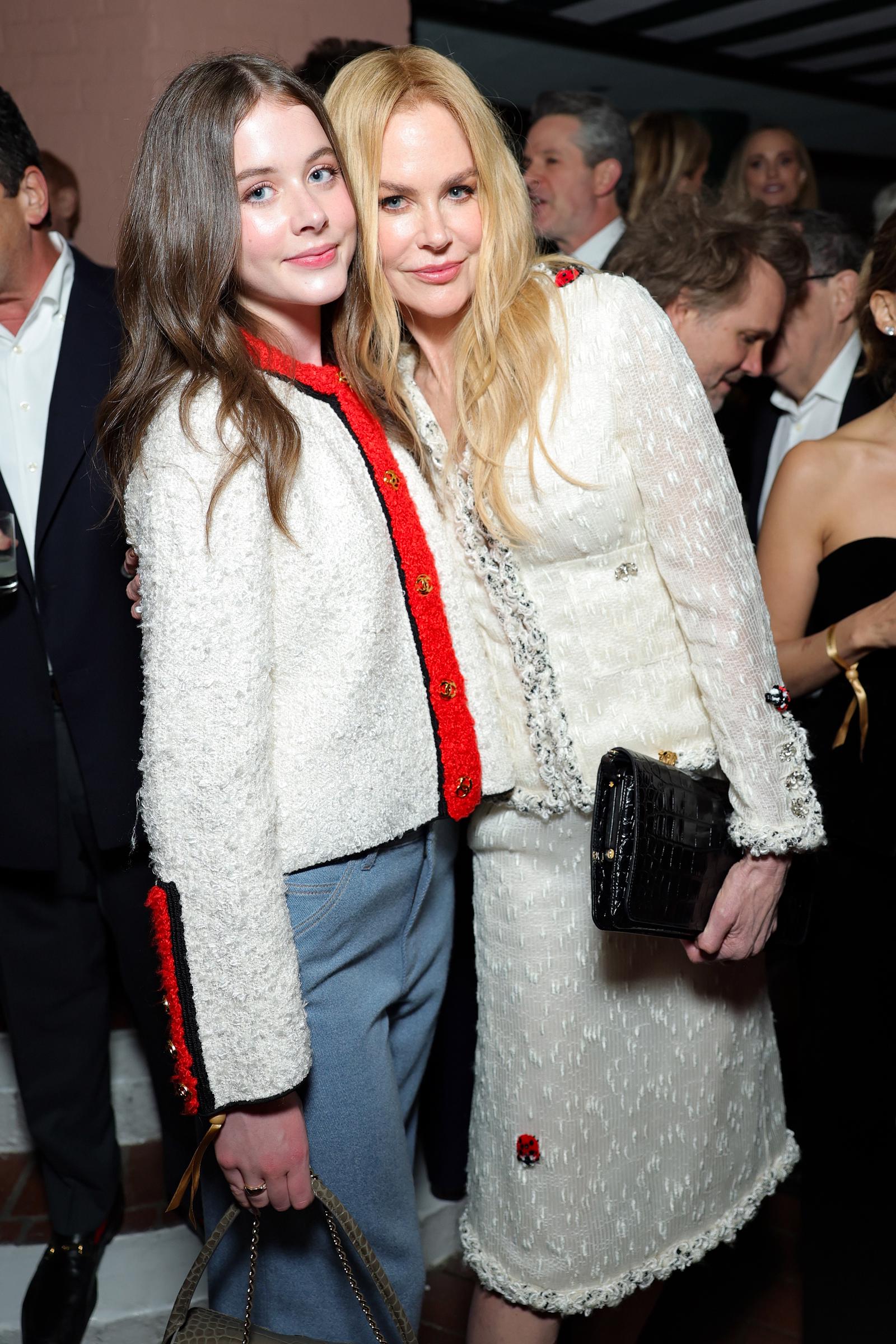 Nicole Kidman and her 15-year-old daughter Faith Margaret attend the Chanel and Charles Finch pre-Oscar dinner in Beverly Hills in March 2026. The pair wear coordinated Chanel outfits, with red trim on Faith's jacket and delicate ladybug embellishments on Nicole's ensemble. | Source: Getty Images