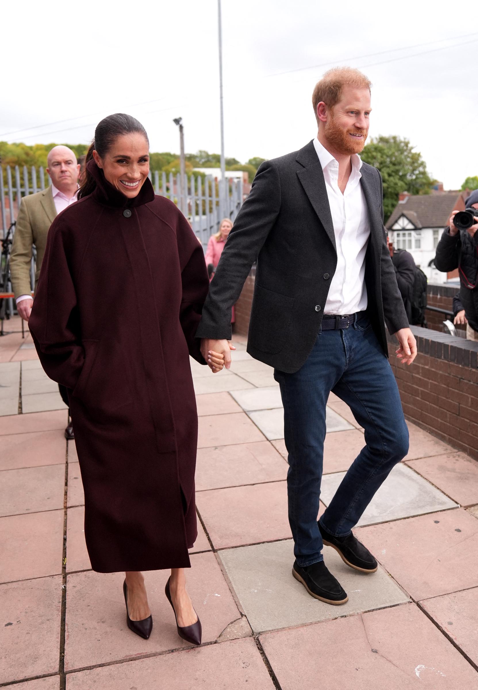 Prince Harry, Duke of Sussex and his wife Meghan, Duchess of Sussex, leave after a visit to Epic Partners in Nottingham, central England on October 15, 2026. | Source: Getty Images