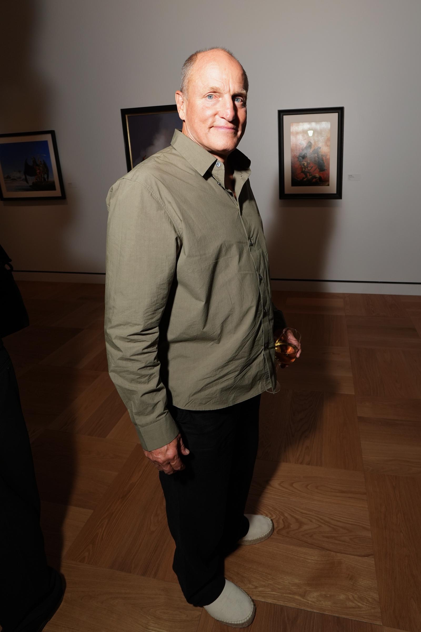 Woody Harrelson was another familiar face inside the museum, where guests explored exhibits spanning film, illustration and fine art. One of the night's more fitting details came when his wife took a photo of him with an Indiana Jones statue. | Source: Getty Images