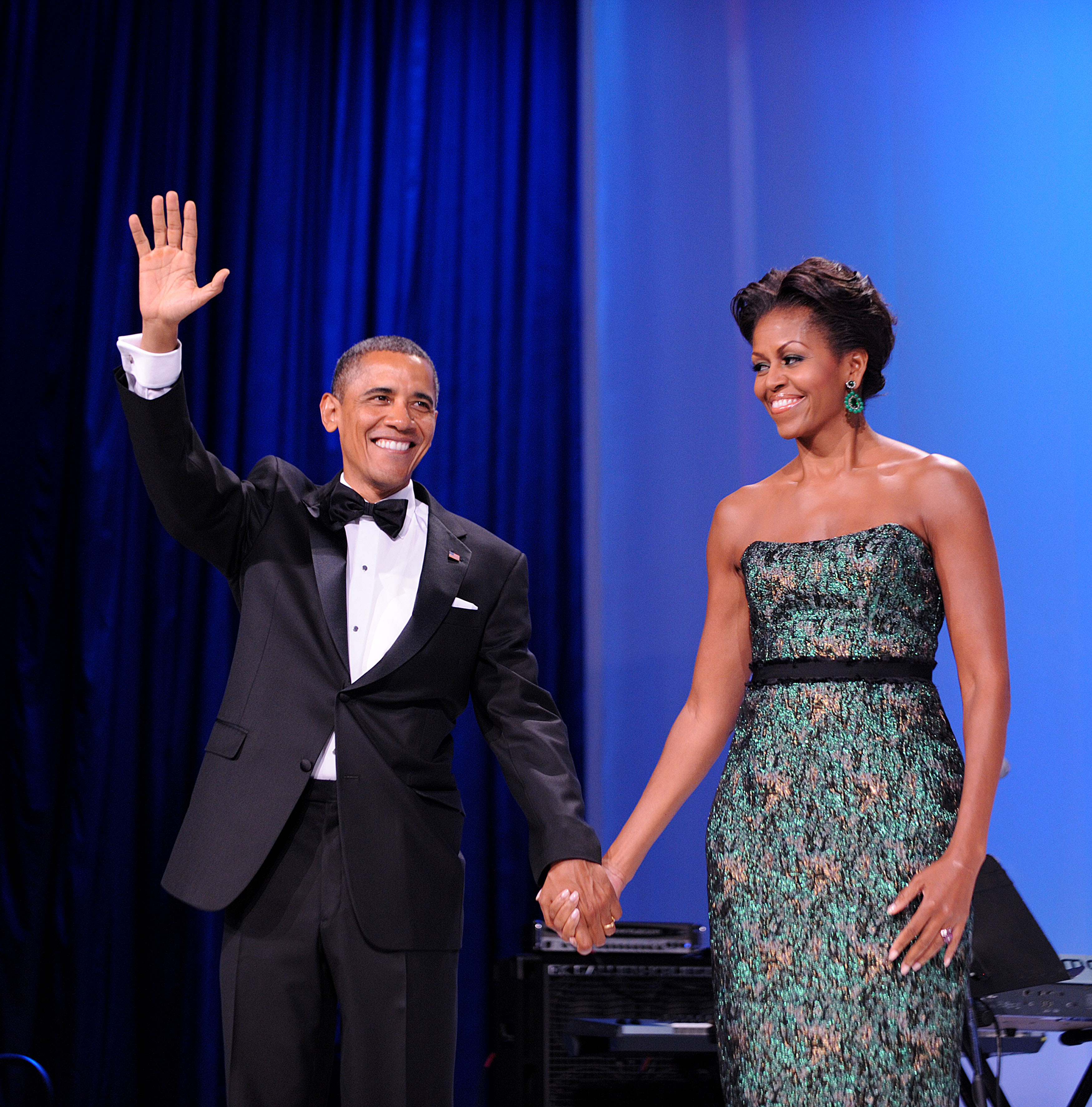 Barack and Michelle hold hands during a formal White House-era event, a reminder that many of their most photographed years unfolded under constant public scrutiny even as Michelle later described the private pressures behind the scenes. | Source: Getty Images