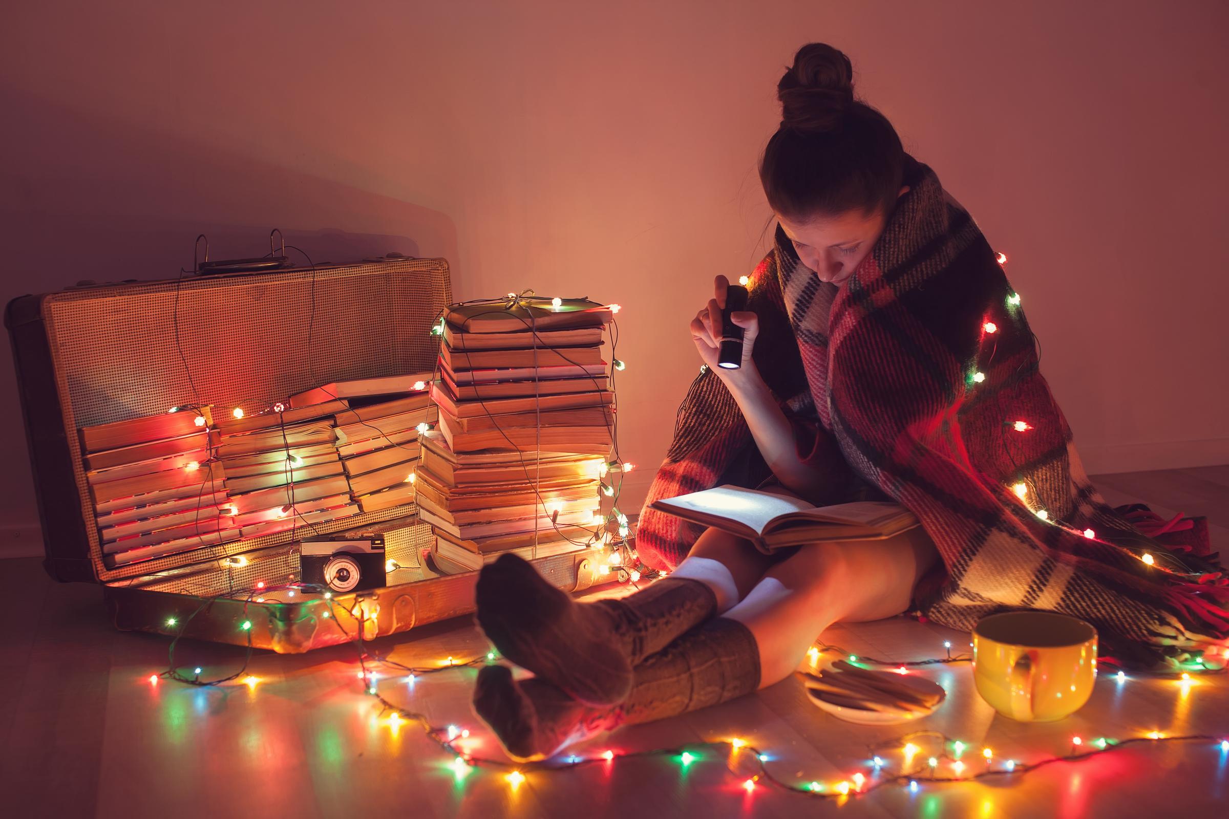 A young girl reading at home | Source: Getty Images