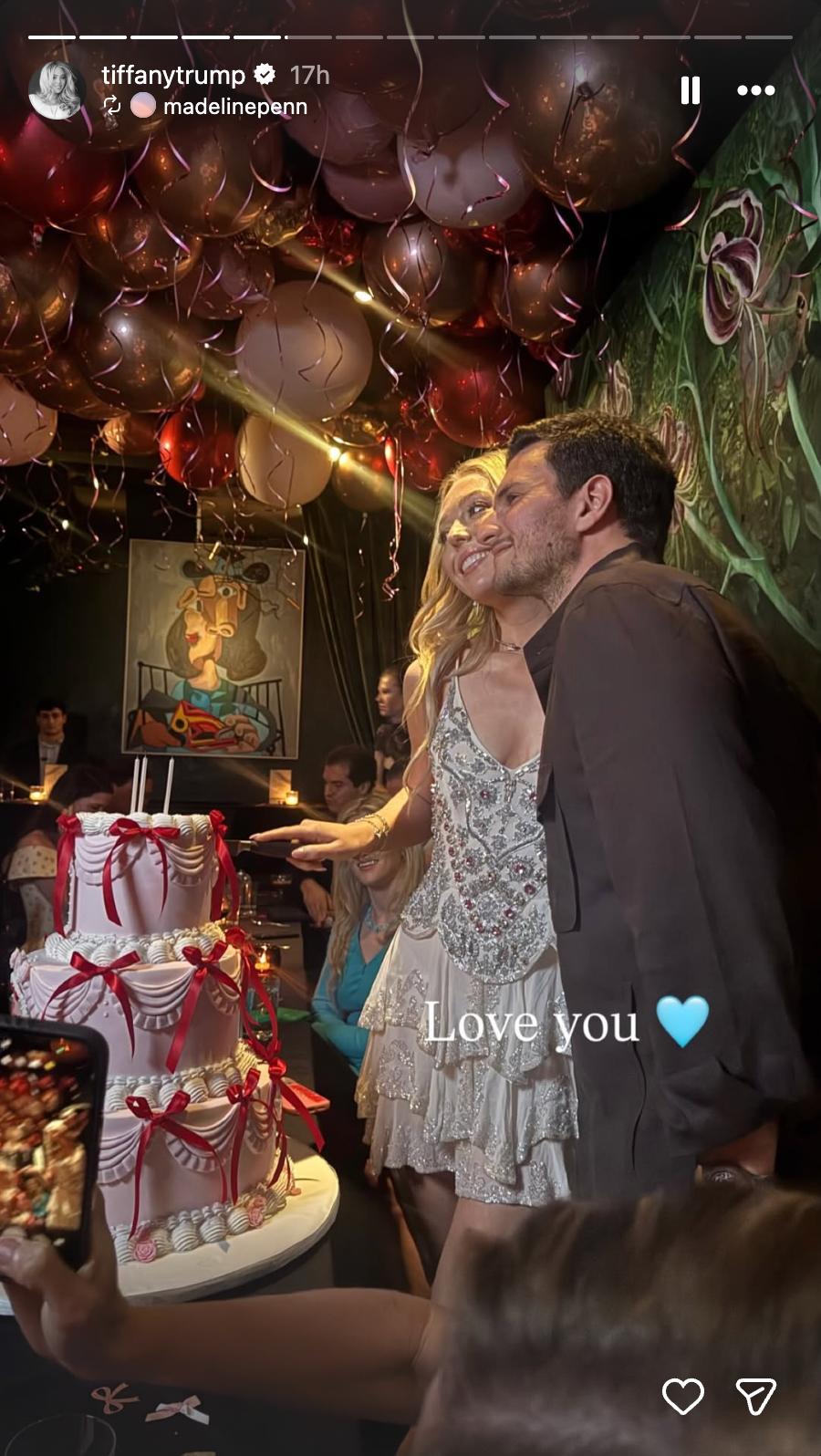 Tiffany and Michael shared a sweet moment beside the ribbon-adorned birthday cake, posing beneath the restaurant's ceiling of metallic balloons. | Source: Instagram/tiffanytrump