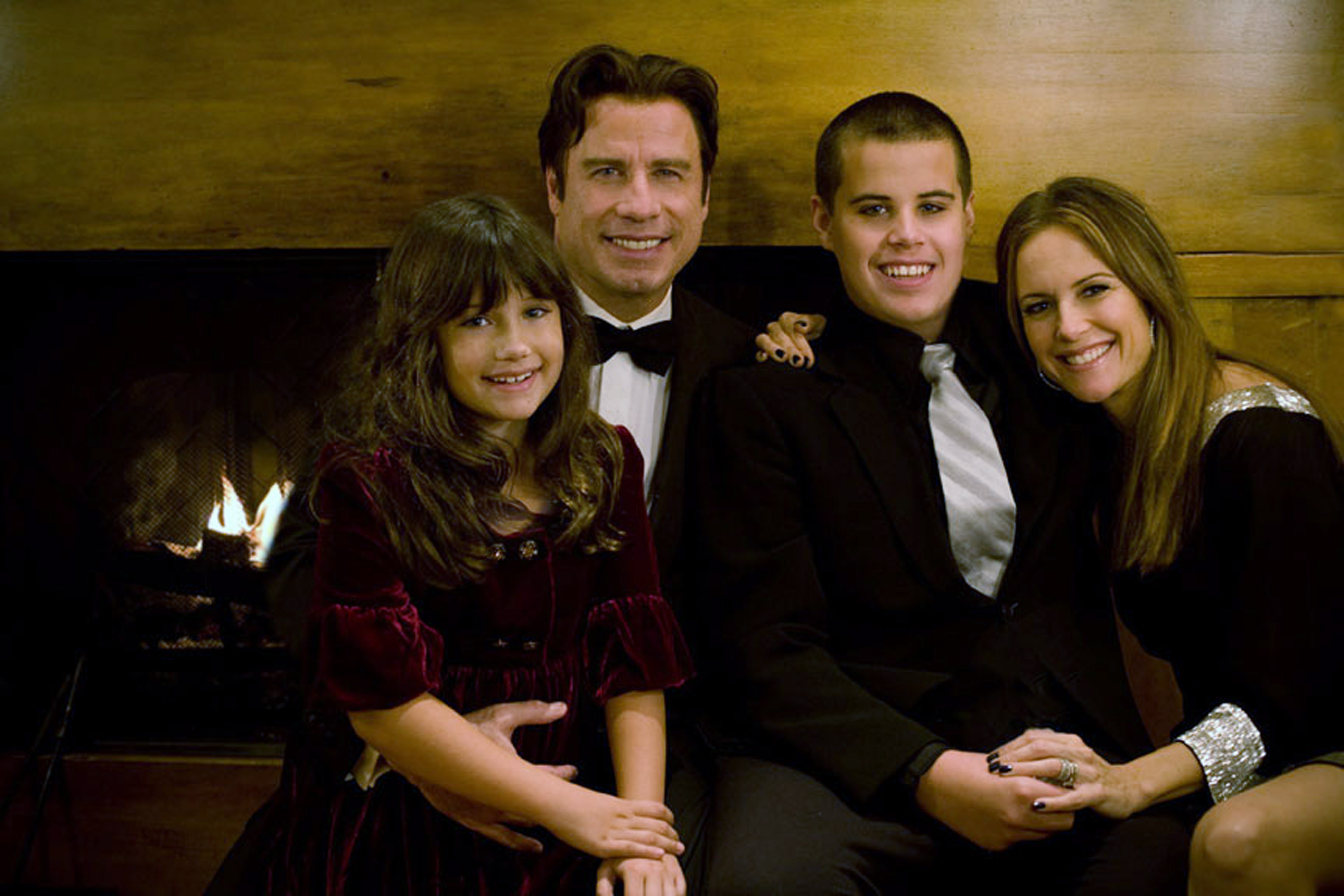 A younger Ella Bleu Travolta poses with her parents, John Travolta and Kelly Preston, alongside her late brother Jett in a rare family photo. | Source: Getty Images