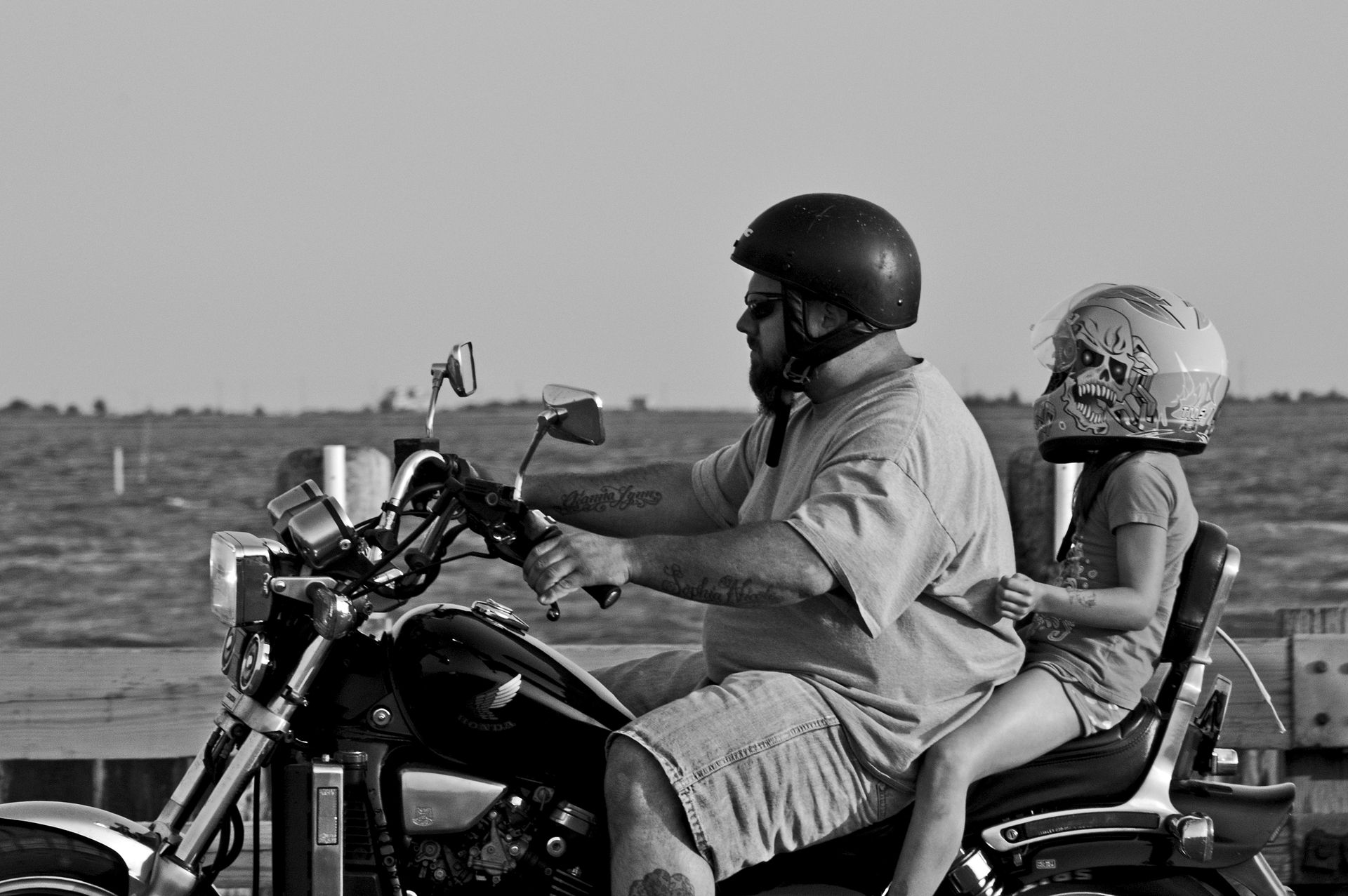 A man and child riding a motorcycle | Source: Pexels