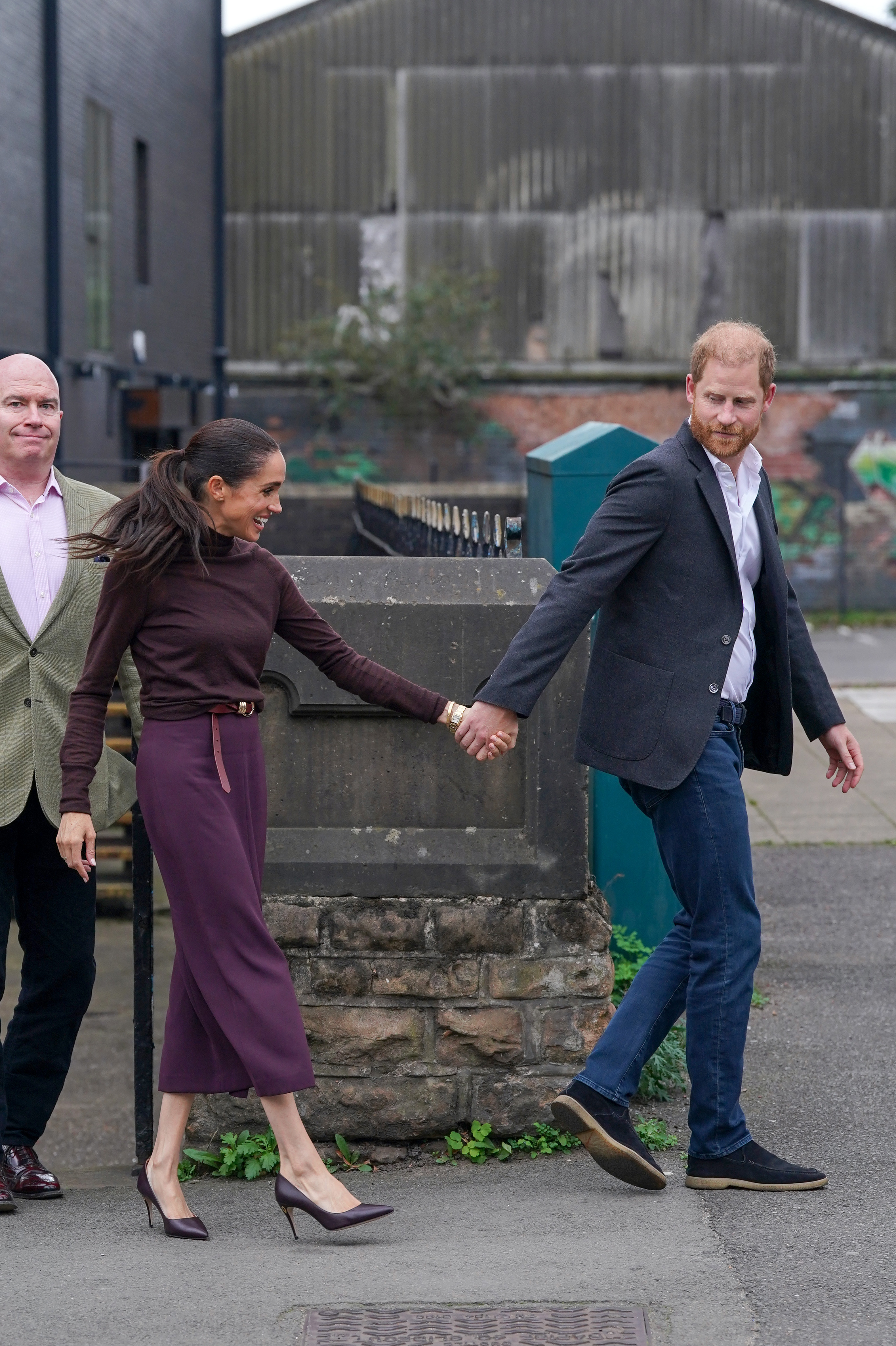 Meghan, Duchess of Sussex, and Prince Harry, Duke of Sussex, leave Himmah Hub, a food poverty community action group. | Source: Getty Images