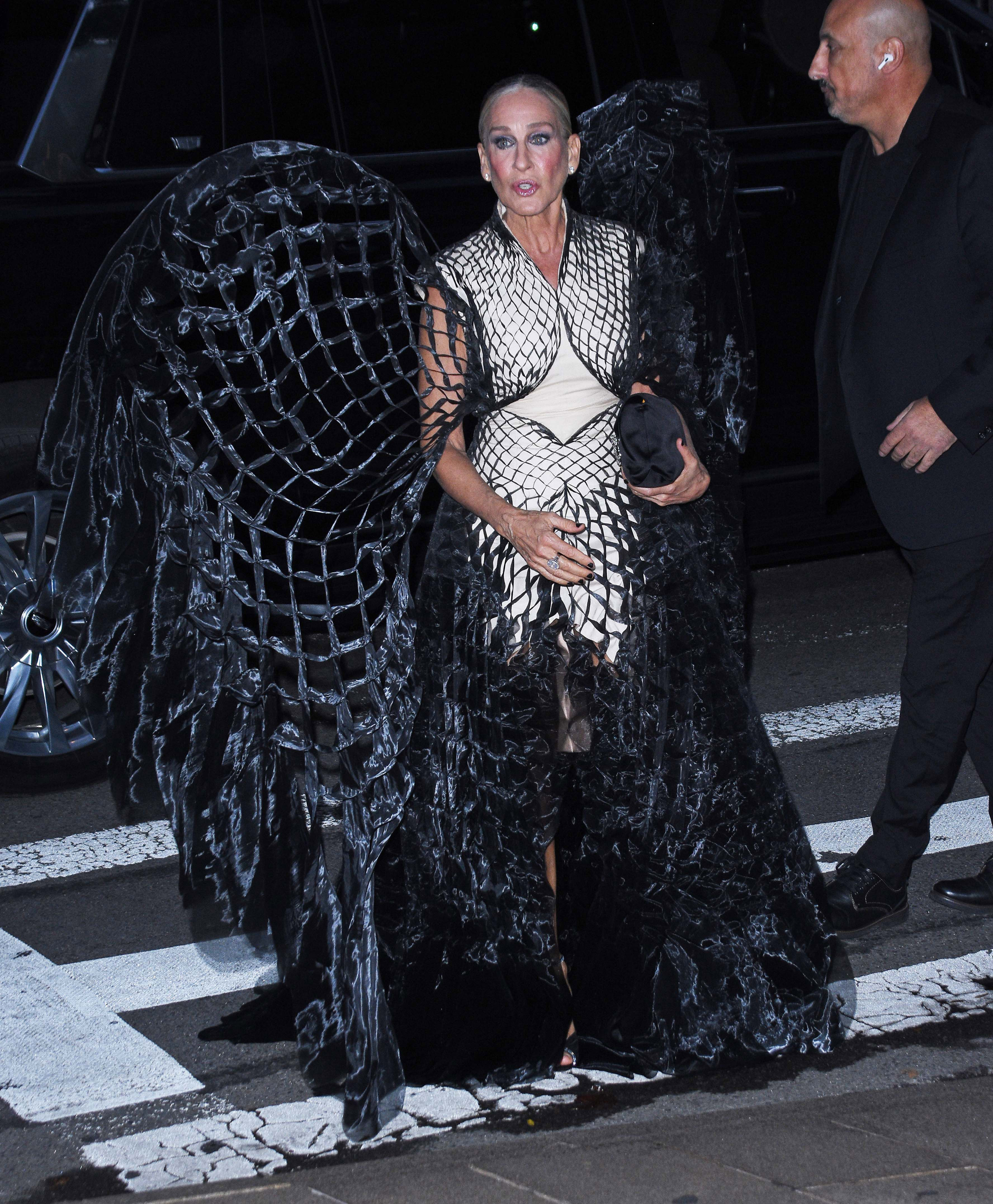 Sarah Jessica Parker arrives at the New York City Ballet 2025 Fall Fashion Gala at Lincoln Center on October 8, 2025, in New York City, wearing a sculptural black-and-white Iris van Herpen gown with dramatic floor-length wing-like details. | Source: Getty Images